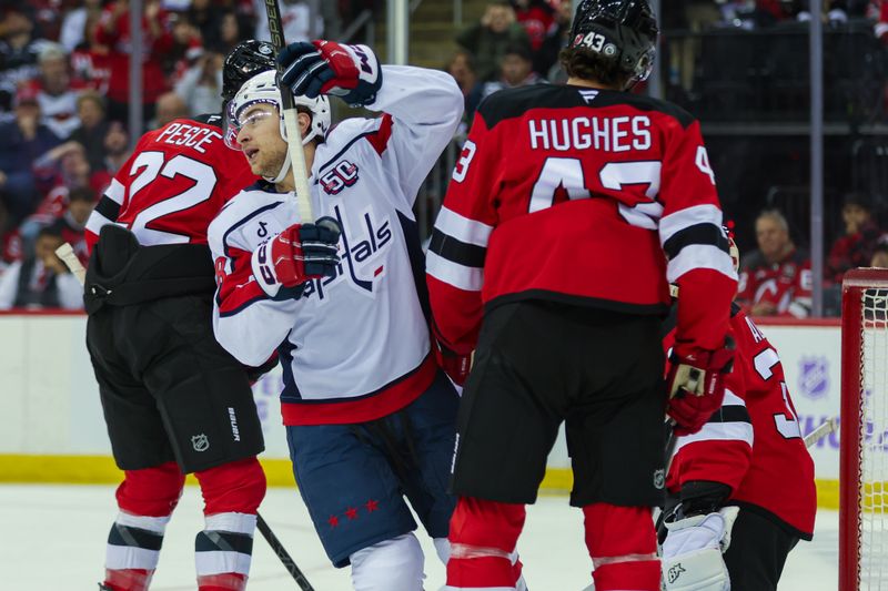Nov 30, 2024; Newark, New Jersey, USA; Washington Capitals left wing Andrew Mangiapane (88) celebrates his goal against the New Jersey Devils during the first period at Prudential Center. Mandatory Credit: Thomas Salus-Imagn Images
