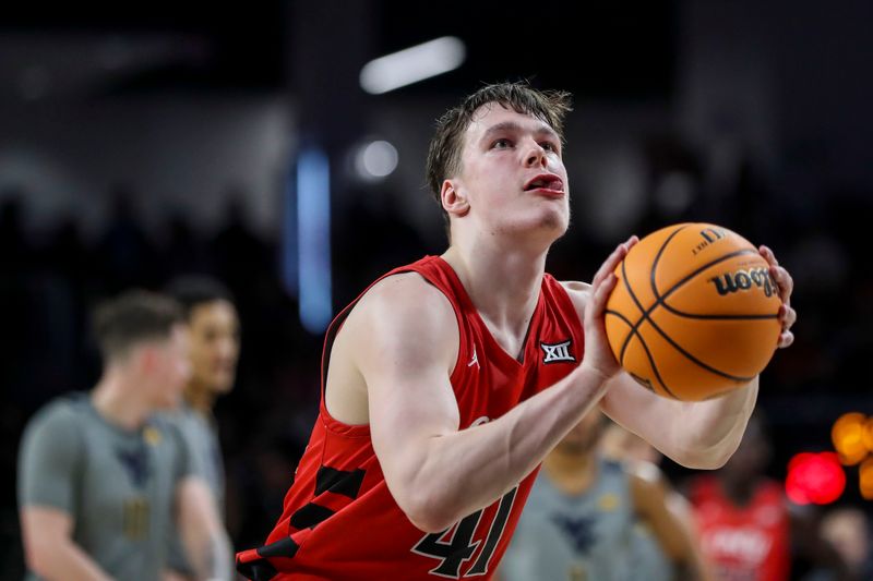 Mar 9, 2024; Cincinnati, Ohio, USA; Cincinnati Bearcats guard Simas Lukosius (41) shoots a technical free throw against the West Virginia Mountaineers in the first half at Fifth Third Arena. Mandatory Credit: Katie Stratman-USA TODAY Sports