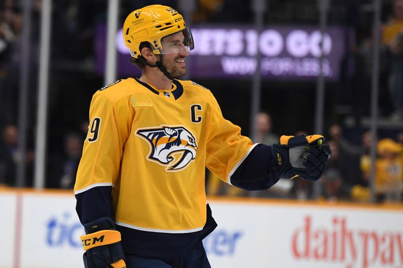 Mar 19, 2024; Nashville, Tennessee, USA; Nashville Predators defenseman Roman Josi (59) celebrates after scoring during the first period against the San Jose Sharks at Bridgestone Arena. Mandatory Credit: Christopher Hanewinckel-USA TODAY Sports