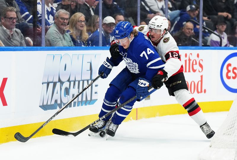 Nov 12, 2024; Toronto, Ontario, CAN; Toronto Maple Leafs center Bobby McMann (74) battles for the puck with Ottawa Senators center Shane Pinto (12) during the third period at Scotiabank Arena. Mandatory Credit: Nick Turchiaro-Imagn Images