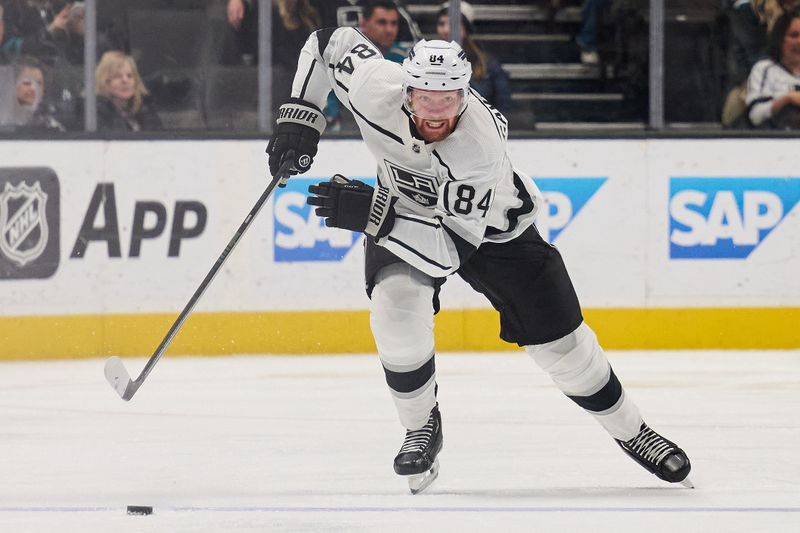 Apr 4, 2024; San Jose, California, USA; Los Angeles Kings defenseman Vladislav Gavrikov (84) skates with the puck against the San Jose Sharks during the third period at SAP Center at San Jose. Mandatory Credit: Robert Edwards-USA TODAY Sports