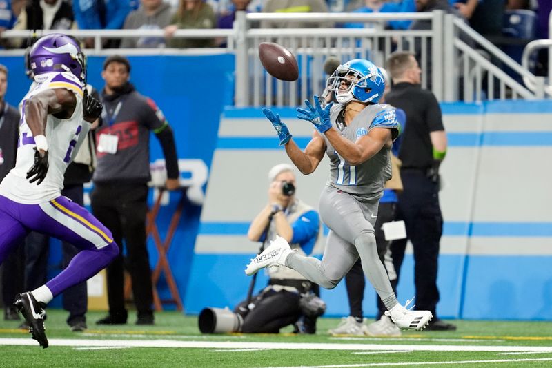 Detroit Lions wide receiver Kalif Raymond (11) catches before going out of bounds during the first half of an NFL football game against the Minnesota Vikings, Sunday, Jan. 7, 2024, in Detroit. (AP Photo/Paul Sancya)