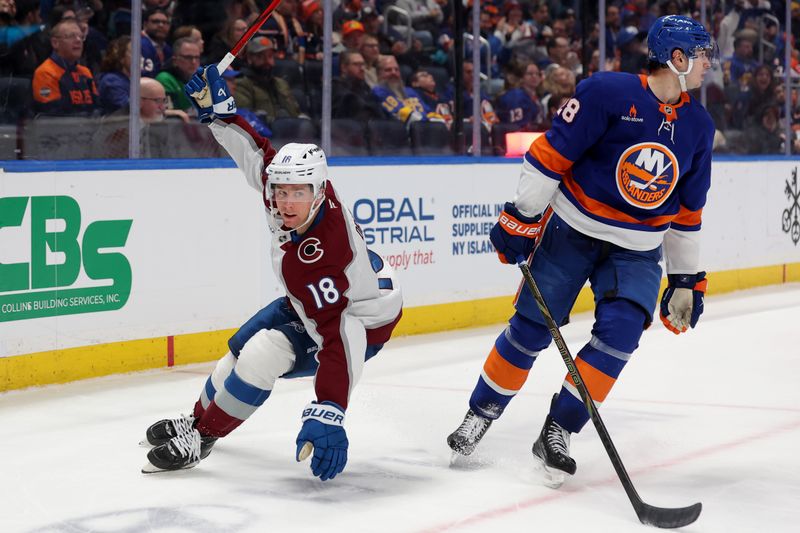 Jan 28, 2025; Elmont, New York, USA; Colorado Avalanche center Jack Drury (18) celebrates his goal against New York Islanders defenseman Alexander Romanov (28) during the third period at UBS Arena. Mandatory Credit: Brad Penner-Imagn Images