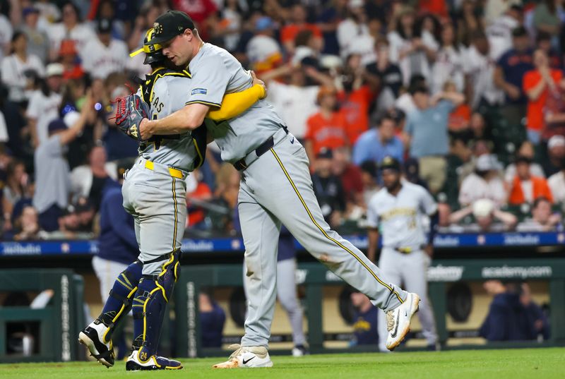 May 18, 2024; Houston, Texas, USA; Milwaukee Brewers relief pitcher Trevor Megill (29) hugs catcher William Contreras (24) after defeating the Houston Astros at Minute Maid Park. Mandatory Credit: Thomas Shea-USA TODAY Sports