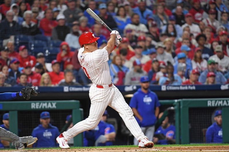 Sep 23, 2024; Philadelphia, Pennsylvania, USA; Philadelphia Phillies catcher J.T. Realmuto (10) hits a home run during the second inning against the Chicago Cubs at Citizens Bank Park. Mandatory Credit: Eric Hartline-Imagn Images