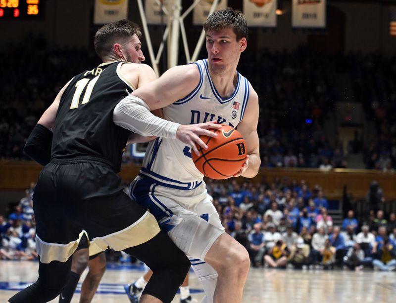 Feb 12, 2024; Durham, North Carolina, USA;  Duke Blue Devils center Kyle Filipowski (30) spins to the basket as Wake Forest Deamon Deacons forward Andrew Carr (11) defends during the second half at Cameron Indoor Stadium. The Blue Devils won 77-69. Mandatory Credit: Rob Kinnan-USA TODAY Sports