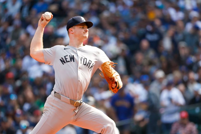 Sep 19, 2024; Seattle, Washington, USA; New York Yankees starting pitcher Clarke Schmidt (36) throws against the Seattle Mariners during the first inning at T-Mobile Park. Mandatory Credit: Joe Nicholson-Imagn Images