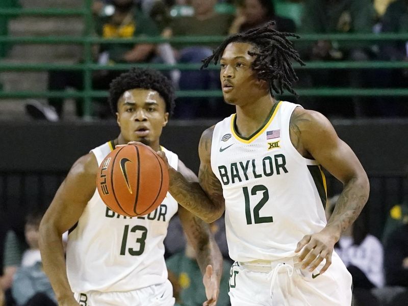 Dec 22, 2023; Waco, Texas, USA; Baylor Bears guard Dantwan Grimes (12) brings the ball up court against the Mississippi Valley State Delta Devils during the first half at Ferrell Center. Mandatory Credit: Raymond Carlin III-USA TODAY Sports