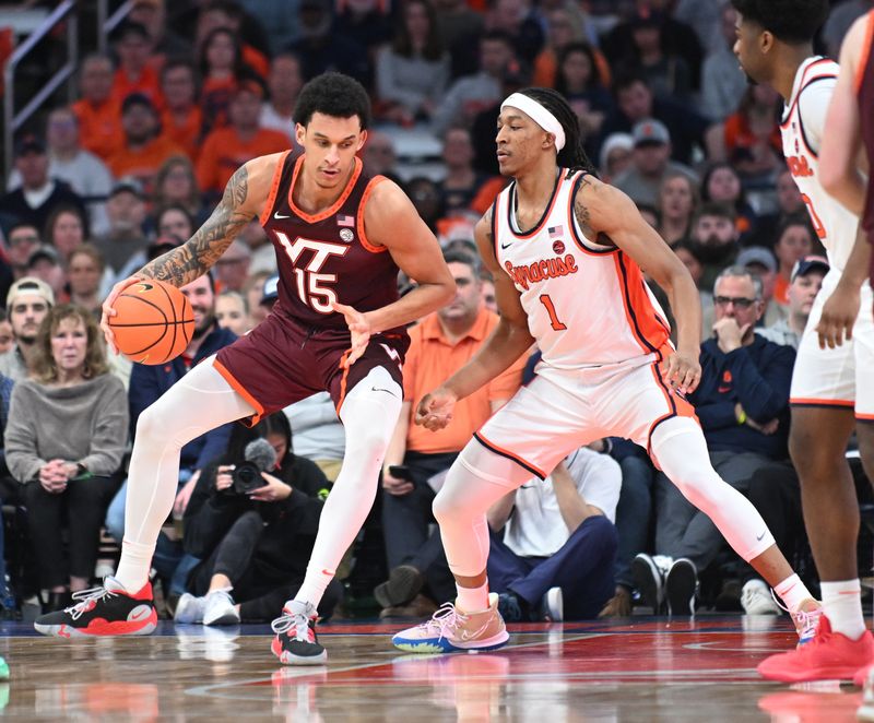 Feb 27, 2024; Syracuse, New York, USA; Virginia Tech Hokies center Lynn Kidd (15)  posts up against Syracuse Orange forward Maliq Brown (1) in the second half at the JMA Wireless Dome. Mandatory Credit: Mark Konezny-USA TODAY Sports