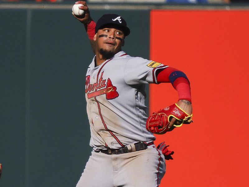 Aug 27, 2023; San Francisco, California, USA; Atlanta Braves shortstop Orlando Arcia (11) throws the ball infield against the San Francisco Giants during the fifth inning at Oracle Park. Mandatory Credit: Kelley L Cox-USA TODAY Sports