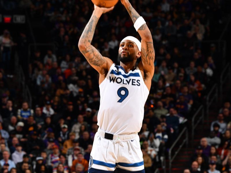 PHOENIX, AZ - JANUARY 29: Nickeil Alexander-Walker #9 of the Minnesota Timberwolves three point basket during the game against the Phoenix Suns on January 29, 2025 at Footprint Center in Phoenix, Arizona. NOTE TO USER: User expressly acknowledges and agrees that, by downloading and or using this photograph, user is consenting to the terms and conditions of the Getty Images License Agreement. Mandatory Copyright Notice: Copyright 2025 NBAE (Photo by Barry Gossage/NBAE via Getty Images)