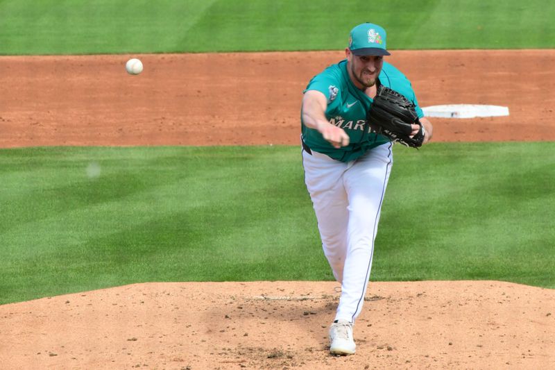 Feb 20, 2026; Peoria, Arizona, USA; Seattle Mariners pitcher Cooper Criswell (18) throws in the third inning against the San Diego Padres during a Spring Training game at Peoria Sports Complex. Mandatory Credit: Matt Kartozian-Imagn Images