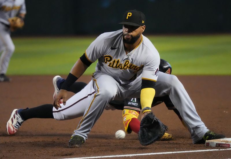 Jul 9, 2023; Phoenix, Arizona, USA;  Pittsburgh Pirates Carlos Santana (41) catches the ball at first base as Arizona Diamondbacks Geraldo Perdomo (2) slides in safely at Chase Field. Mandatory Credit: Joe Rondone-USA TODAY Sports