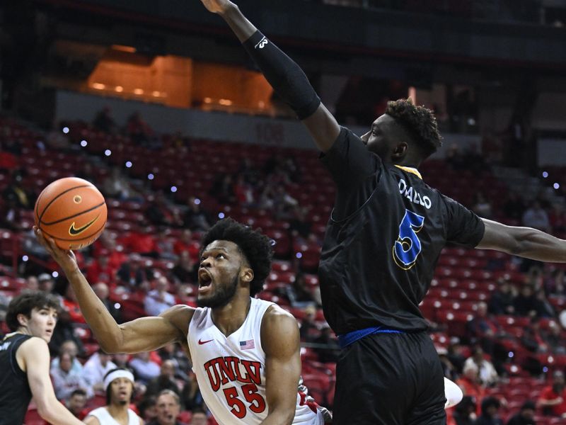 Feb 14, 2023; Las Vegas, Nevada, USA; UNLV Runnin' Rebels guard EJ Harkless (55) collides with San Jose State Spartans center Ibrahima Diallo (5) in the first half at Thomas & Mack Center. Mandatory Credit: Candice Ward-USA TODAY Sports