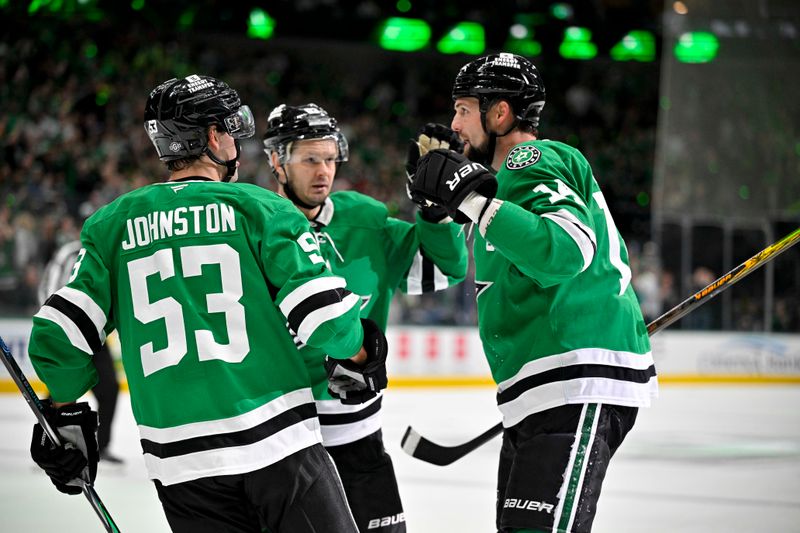 Oct 12, 2024; Dallas, Texas, USA; Dallas Stars center Wyatt Johnston (53) and right wing Evgenii Dadonov (63) and left wing Jamie Benn (14) celebrates a goal scored by Benn against the New York Islanders during the second period at the American Airlines Center. Mandatory Credit: Jerome Miron-Imagn Images