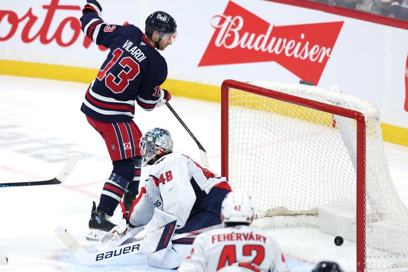 Dec 13, 2025; Winnipeg, Manitoba, CAN; Winnipeg Jets center Gabriel Vilardi (13) scores on Washington Capitals goaltender Logan Thompson (48) in the second periodat Canada Life Centre. Mandatory Credit: James Carey Lauder-Imagn Images