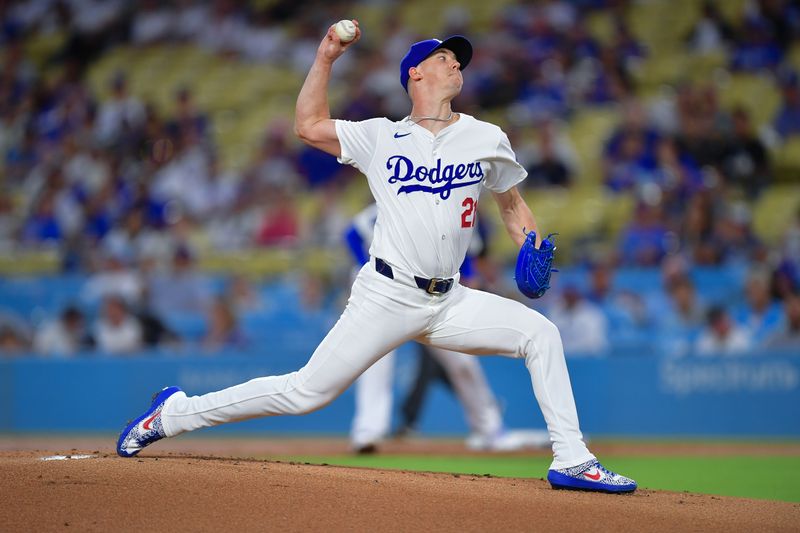 Sep 9, 2024; Los Angeles, California, USA; Los Angeles Dodgers pitcher Walker Buehler (21) throws against the Chicago Cubs during the first inning  at Dodger Stadium. Mandatory Credit: Gary A. Vasquez-Imagn Images