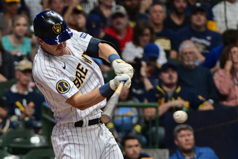 Sep 16, 2023; Milwaukee, Wisconsin, USA; Milwaukee Brewers left fielder Mark Canha (21) hits a single in the third inning against the Washington Nationals at American Family Field. Mandatory Credit: Benny Sieu-USA TODAY Sports