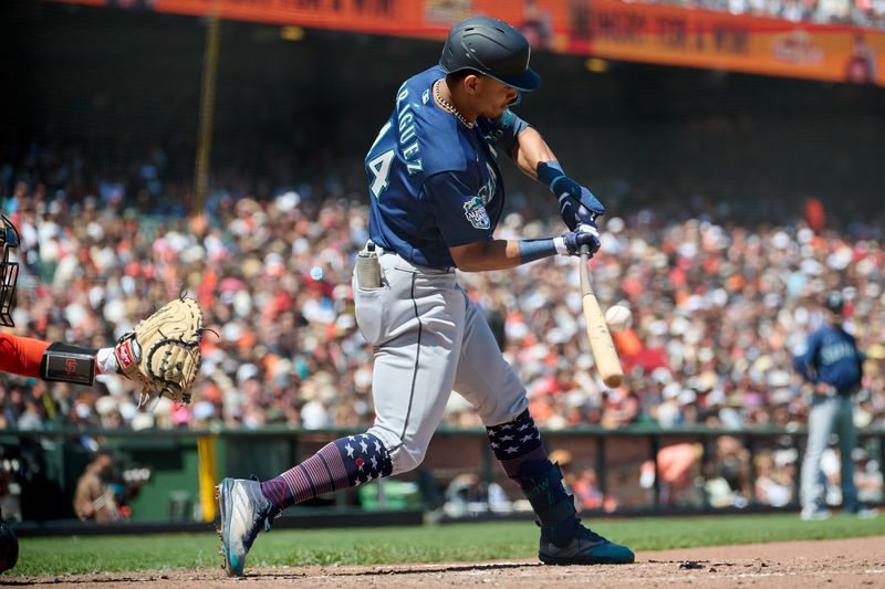 Jul 4, 2023; San Francisco, California, USA; Seattle Mariners outfielder Julio Rodriguez (44) hits an RBI single against the San Francisco Giants during the sixth inning at Oracle Park. Mandatory Credit: Robert Edwards-USA TODAY Sports