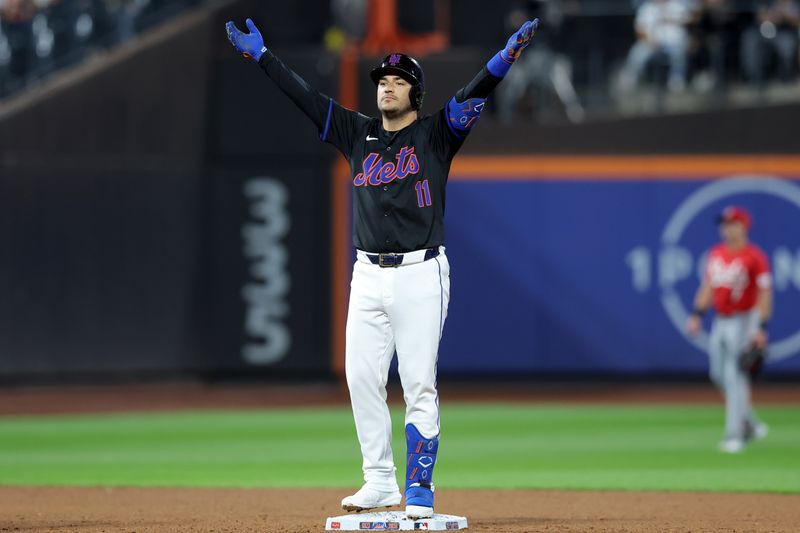 Sep 6, 2024; New York City, New York, USA; New York Mets pinch hitter Jose Iglesias (11) reacts after his RBI double against the Cincinnati Reds during the sixth inning at Citi Field. Mandatory Credit: Brad Penner-Imagn Images