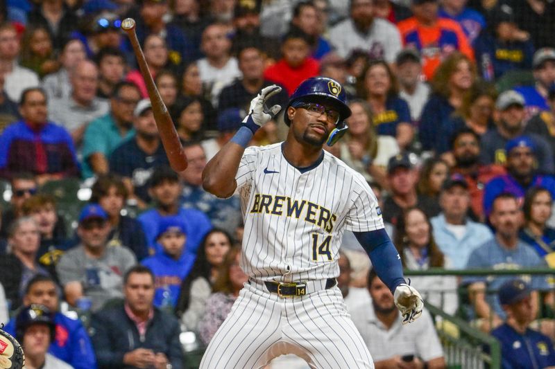 Sep 28, 2024; Milwaukee, Wisconsin, USA; Milwaukee Brewers second baseman Andruw Monasterio (14) reacts after striking out in the fourth inning against the New York Mets at American Family Field. Mandatory Credit: Benny Sieu-Imagn Images