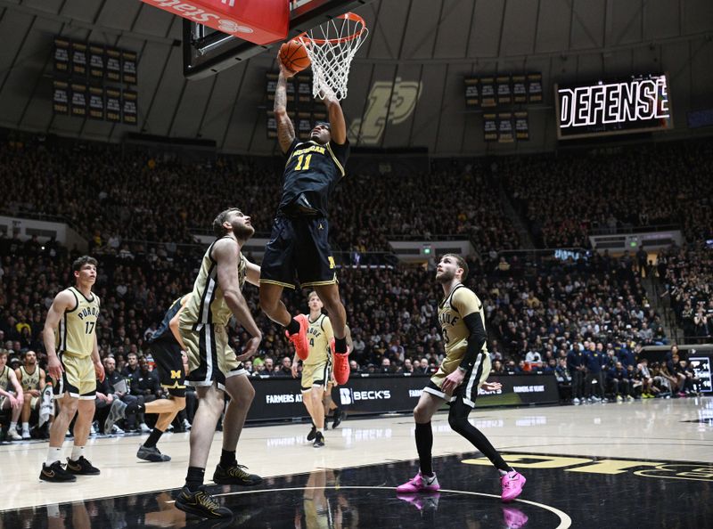 Feb 17, 2026; West Lafayette, Indiana, USA; Michigan Wolverines guard Roddy Gayle Jr. (11) shoots the ball in front of several Purdue Boilermakers during the first half at Mackey Arena. Mandatory Credit: Marc Lebryk-Imagn Images