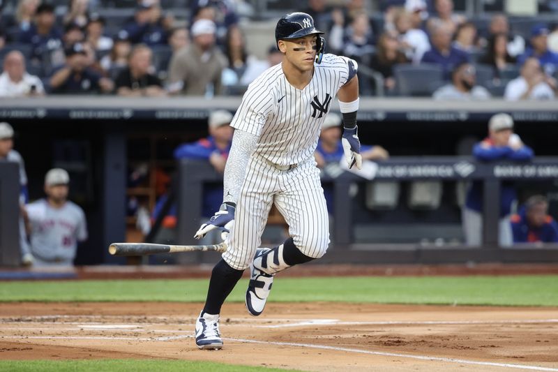 May 18, 2025; Bronx, New York, USA;  New York Yankees right fielder Aaron Judge (99) hits a double in the first inning against the New York Mets at Yankee Stadium. Mandatory Credit: Wendell Cruz-Imagn Images