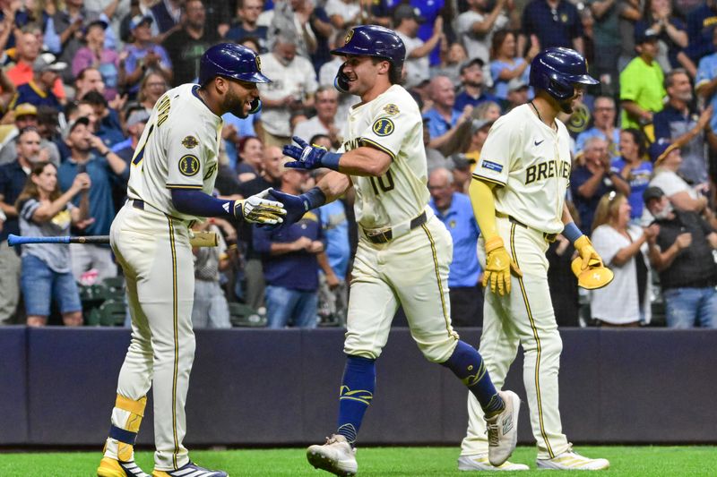 Sep 17, 2025; Milwaukee, Wisconsin, USA; Milwaukee Brewers right fielder Sal Frelick (10) is greeted by left fielder Jackson Chourio (11) after hitting a three-run homer against the Los Angeles Angels in the second inning at American Family Field. Mandatory Credit: Benny Sieu-Imagn Images