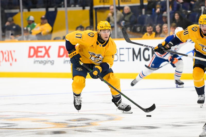 Oct 17, 2024; Nashville, Tennessee, USA;  Nashville Predators center Mark Jankowski (17) skates with the puck against the Edmonton Oilers during the third period at Bridgestone Arena. Mandatory Credit: Steve Roberts-Imagn Images