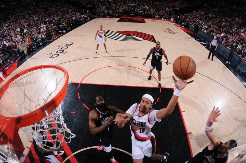 PORTLAND, OR - MARCH 22:  Moses Brown #10 of the Portland Trail Blazers goes to the basket during the game on March 22, 2024 at the Moda Center Arena in Portland, Oregon. NOTE TO USER: User expressly acknowledges and agrees that, by downloading and or using this photograph, user is consenting to the terms and conditions of the Getty Images License Agreement. Mandatory Copyright Notice: Copyright 2024 NBAE (Photo by Cameron Browne/NBAE via Getty Images)