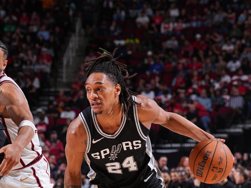 HOUSTON, TX - FEBRUARY 26:  Devin Vassell #24 of the San Antonio Spurs handles the ball during the game against the Houston Rockets on February 26, 2025 at the Toyota Center in Houston, Texas. NOTE TO USER: User expressly acknowledges and agrees that, by downloading and or using this photograph, User is consenting to the terms and conditions of the Getty Images License Agreement. Mandatory Copyright Notice: Copyright 2025 NBAE (Photo by Garrett Ellwood/NBAE via Getty Images)