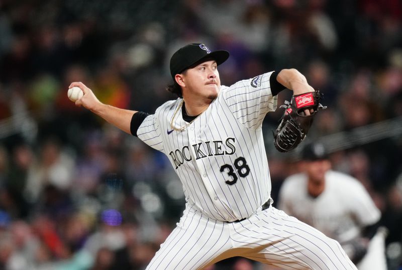 Apr 9, 2024; Denver, Colorado, USA; Colorado Rockies relief pitcher Victor Vodnik (38) delivers a pitch in the seventh inning against the Arizona Diamondbacks at Coors Field. Mandatory Credit: Ron Chenoy-USA TODAY Sports