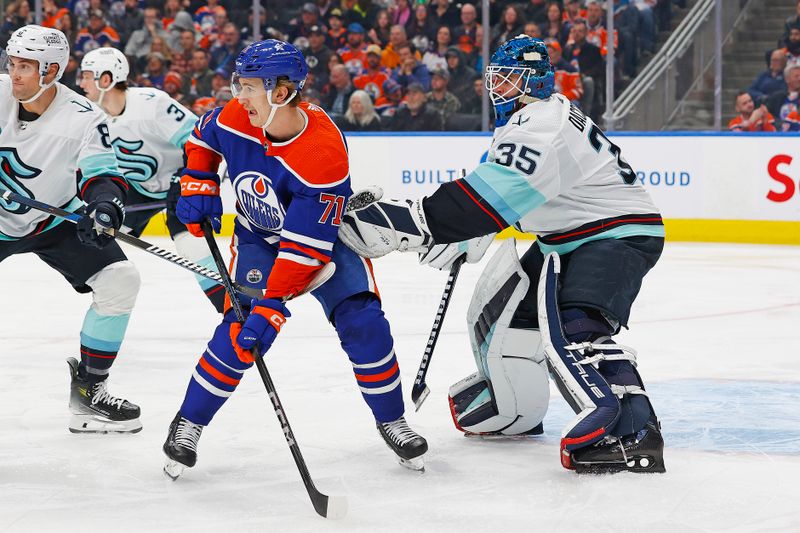 Nov 15, 2023; Edmonton, Alberta, CAN; Edmonton Oilers forward Ryan McLeod (71) tries to screen Seattle Kraken goaltender Joey Daccord (35) during the third period at Rogers Place. Mandatory Credit: Perry Nelson-USA TODAY Sports