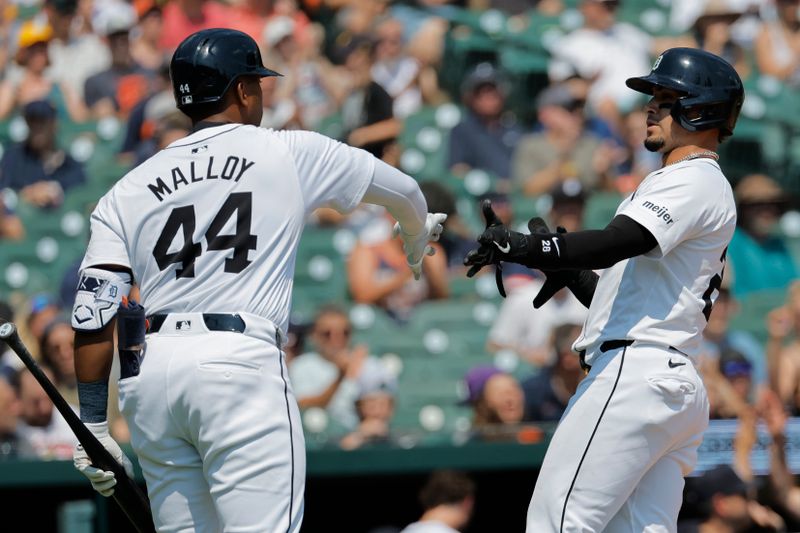 Aug 4, 2024; Detroit, Michigan, USA;  Detroit Tigers shortstop  Javier Baez (28) receives congratulations from Detroit Tigers outfielder Justyn-Henry Malloy (44) after scoring in the fifth inning against the Kansas City Royals at Comerica Park. Mandatory Credit: Rick Osentoski-USA TODAY Sports