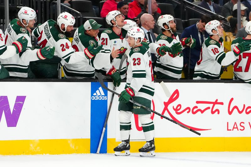 Feb 12, 2024; Las Vegas, Nevada, USA; Minnesota Wild center Marco Rossi (23) celebrates after scoring a goal against the Vegas Golden Knights during the third period at T-Mobile Arena. Mandatory Credit: Stephen R. Sylvanie-USA TODAY Sports