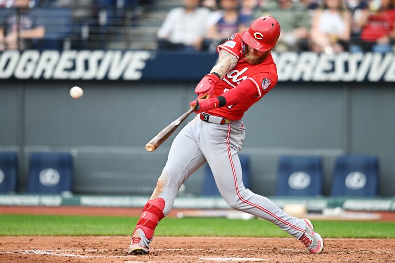 Jun 9, 2025; Cleveland, Ohio, USA; Cincinnati Reds right fielder Jake Fraley (27) hits a home run during the fourth inning against the Cleveland Guardians at Progressive Field. Mandatory Credit: Ken Blaze-Imagn Images