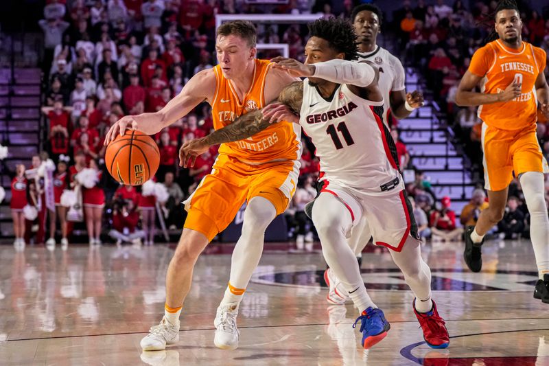 Jan 13, 2024; Athens, Georgia, USA; Tennessee Volunteers guard Dalton Knecht (3) dribbles against the Georgia Bulldogs guard Justin Hill (11) at Stegeman Coliseum. Mandatory Credit: Dale Zanine-USA TODAY Sports