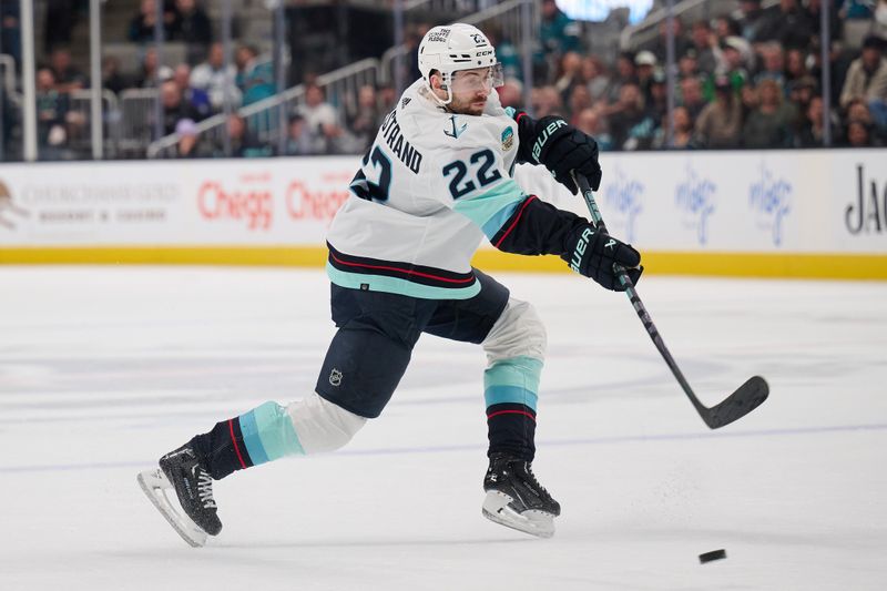 Jan 30, 2024; San Jose, California, USA; Seattle Kraken right wing Oliver Bjorkstrand (22) shoots the puck against the San Jose Sharks during the third period at SAP Center at San Jose. Mandatory Credit: Robert Edwards-USA TODAY Sports