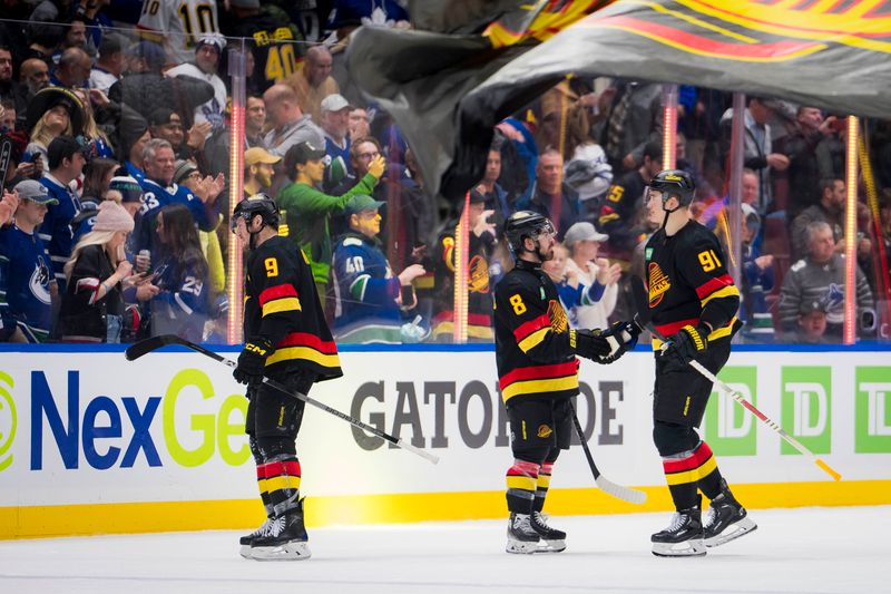 Jan 20, 2024; Vancouver, British Columbia, CAN; Vancouver Canucks forward J.T. Miller (9), forward Conor Garland (8) and defenseman Nikita Zadorov (91) celebrate their victory against the Toronto Maple Leafs at Rogers Arena. Canucks won 6-4. Mandatory Credit: Bob Frid-USA TODAY Sports