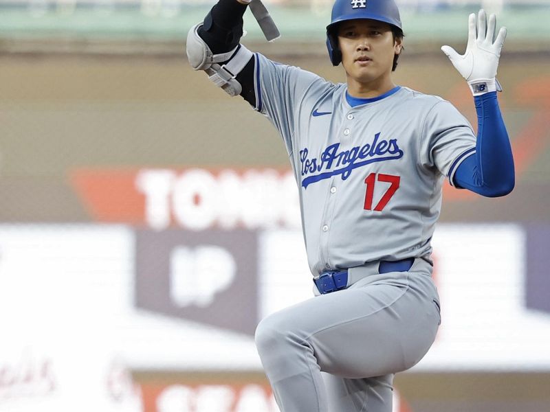 Apr 24, 2024; Washington, District of Columbia, USA; Los Angeles Dodgers designated hitter Shohei Ohtani (17) gestures to his dugout after hitting a double against the Washington Nationals during the first inning at Nationals Park. Mandatory Credit: Geoff Burke-USA TODAY Sports