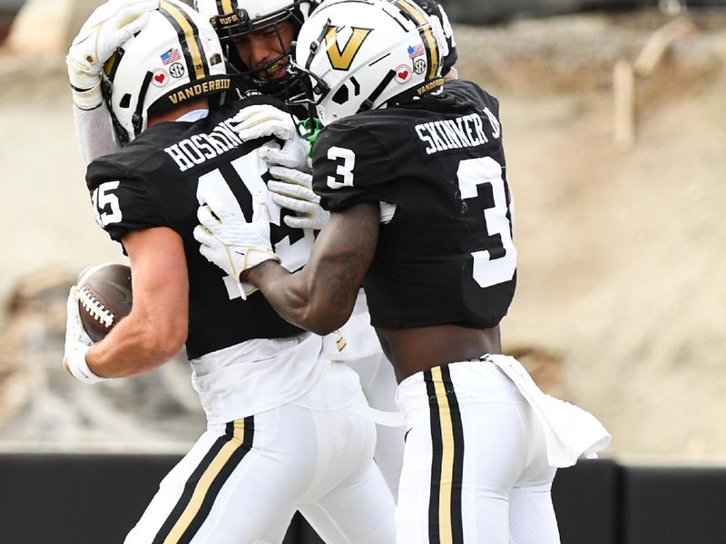 Oct 14, 2023; Nashville, Tennessee, USA; Vanderbilt Commodores players celebrate after a touchdown by wide receiver Richie Hoskins (15) during the second half at FirstBank Stadium. Mandatory Credit: Christopher Hanewinckel-USA TODAY Sports