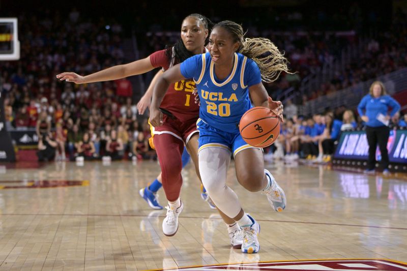 Jan 14, 2024; Los Angeles, California, USA; UCLA Bruins guard Charisma Osborne (20) drives past USC Trojans guard Taylor Bigby (1) in the first half at Galen Center. Mandatory Credit: Jayne Kamin-Oncea-USA TODAY Sports