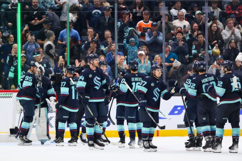 Oct 17, 2024; Seattle, Washington, USA; The Seattle Kraken celebrate defeating the Philadelphia Flyers at Climate Pledge Arena. Mandatory Credit: Steven Bisig-Imagn Images