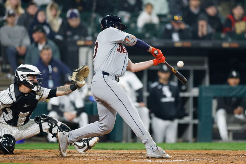 Jun 4, 2025; Chicago, Illinois, USA; Detroit Tigers designated hitter Colt Keith (33) hits an RBI-single against the Chicago White Sox during the eight inning at Rate Field. Mandatory Credit: Kamil Krzaczynski-Imagn Images
