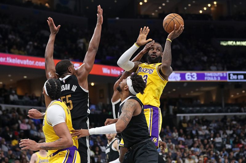 MEMPHIS, TENNESSEE - APRIL 12: LeBron James #23 of the Los Angeles Lakers looks on during the game against the Memphis Grizzlies at FedExForum on April 12, 2024 in Memphis, Tennessee. NOTE TO USER: User expressly acknowledges and agrees that, by downloading and or using this photograph, User is consenting to the terms and conditions of the Getty Images License Agreement. (Photo by Justin Ford/Getty Images)