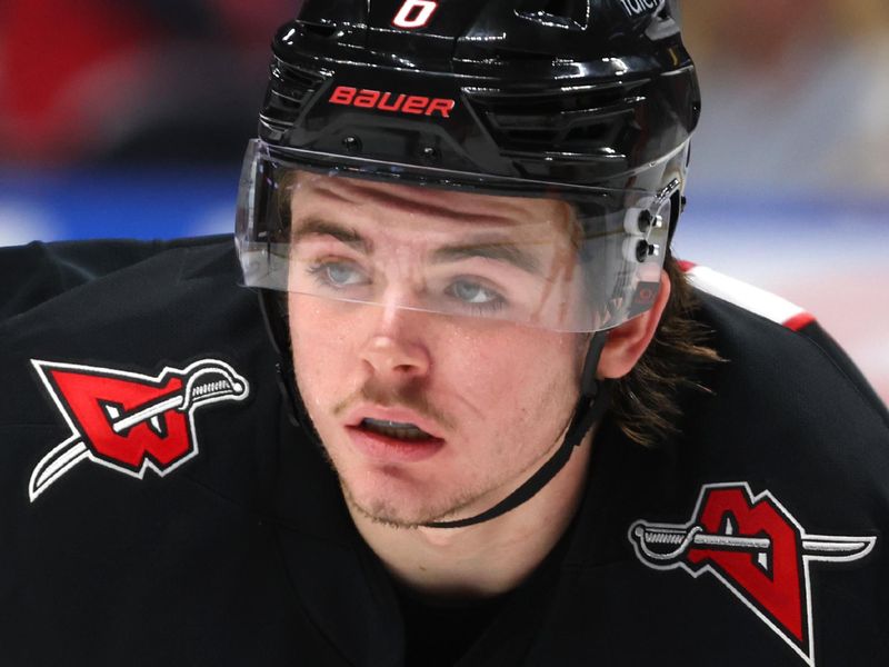 Jan 10, 2026; Buffalo, New York, USA;  Buffalo Sabres left wing Zach Benson (6) waits for the faceoff during the second period against the Anaheim Ducks at KeyBank Center. Mandatory Credit: Timothy T. Ludwig-Imagn Images