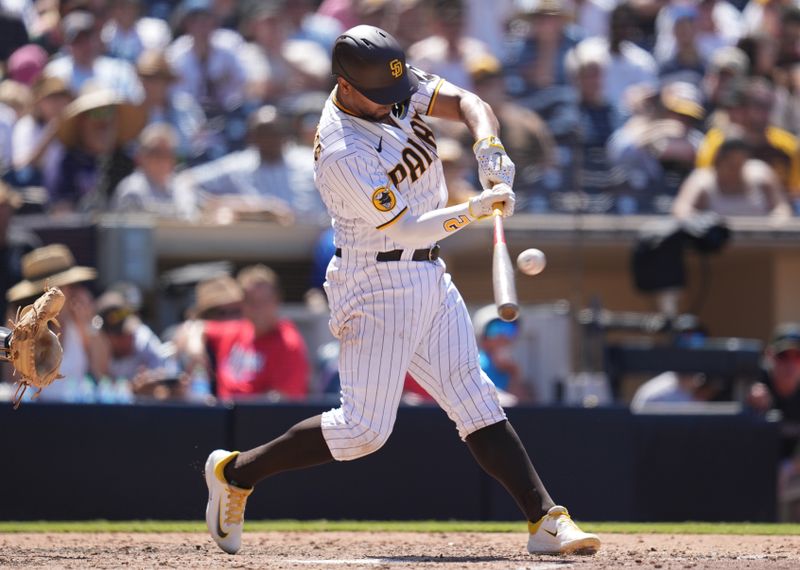 Aug 23, 2023; San Diego, California, USA;  San Diego Padres shortstop Xander Bogaerts (2) hits a two run home run against the Miami Marlins during the sixth inning at Petco Park. Mandatory Credit: Ray Acevedo-USA TODAY Sports