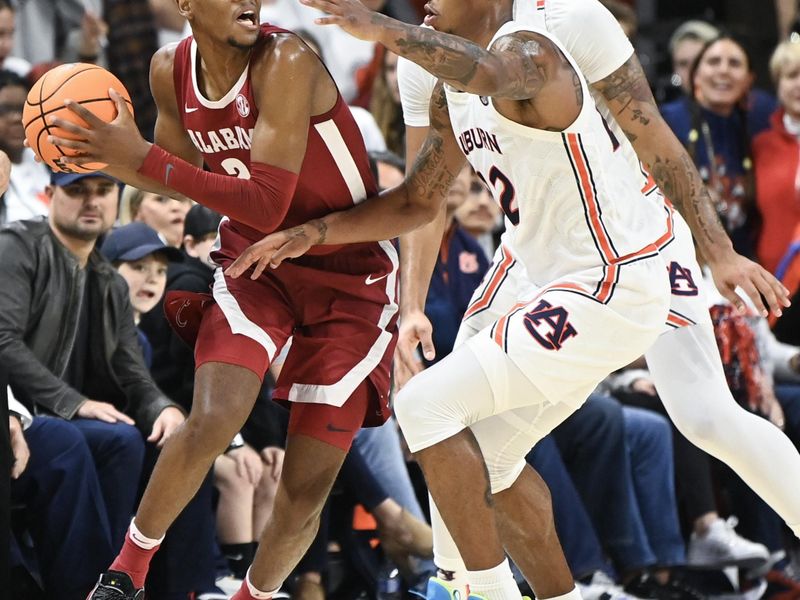 Feb 11, 2023; Auburn, Alabama, USA;  Alabama Crimson Tide forward Brandon Miller (24) passes the ball around Auburn Tigers guard Allen Flanigan (22) at Neville Arena. Mandatory Credit: Julie Bennett-USA TODAY Sports

