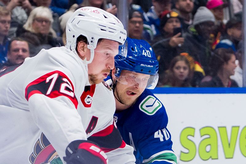 Jan 2, 2024; Vancouver, British Columbia, CAN; Vancouver Canucks forward Elias Pettersson (40) battles with Ottawa Senators defenseman Thomas Chabot (72) in the third period at Rogers Arena. Mandatory Credit: Bob Frid-USA TODAY Sports