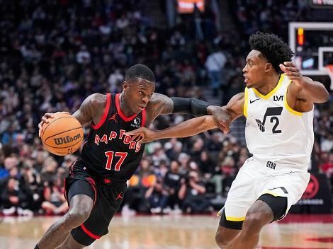 TORONTO, ON - DECEMBER 23: Dennis Schroder #17 of the Toronto Raptors drives against Collin Sexton #2 of the Utah Jazz during the first half of their basketball game at the Scotiabank Arena on December 23, 2023 in Toronto, Ontario, Canada. NOTE TO USER: User expressly acknowledges and agrees that, by downloading and/or using this Photograph, user is consenting to the terms and conditions of the Getty Images License Agreement. (Photo by Mark Blinch/Getty Images)